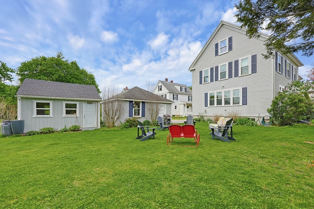 24 Riverside Place Walpole, MA 02081 - Photo 36 of 39 a front view of a house with garden