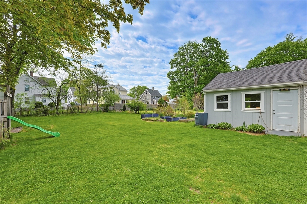 24 Riverside Place Walpole, MA 02081 - Photo 38 of 39 a view of a house with a backyard