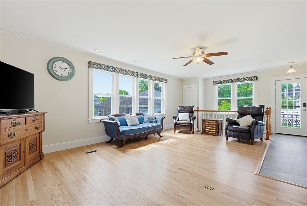 24 Riverside Place Walpole, MA 02081 - Photo 7 of 39 a living room with furniture and a flat screen tv