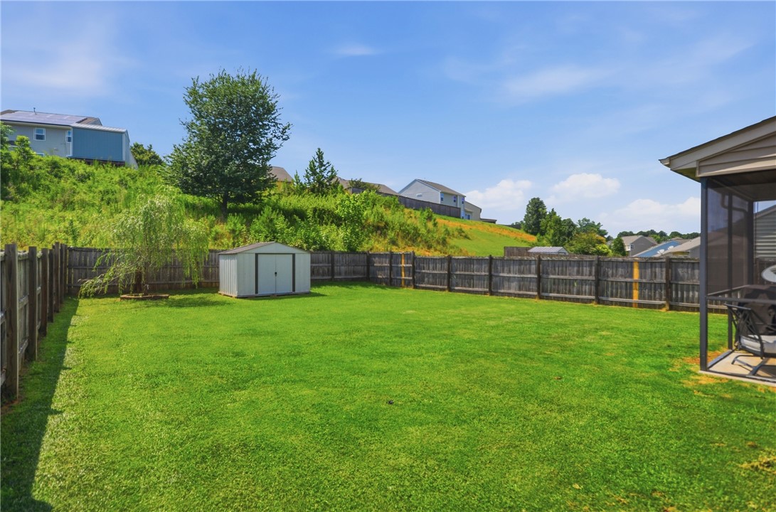 347 Riverdale Road Simpsonville, SC 29680 - Photo 24 of 30 A spacious backyard with mature trees and privacy fencing awaits your personal touch.