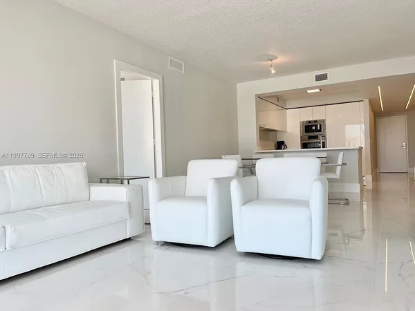a living room with furniture and a couch