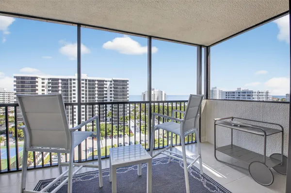 a view of a balcony with chairs