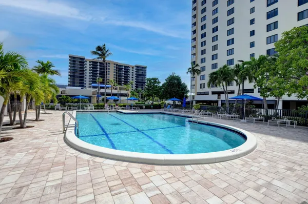 a view of outdoor space with swimming pool and lounge chair