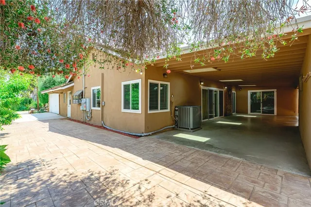 a view of a house with a snow on the road