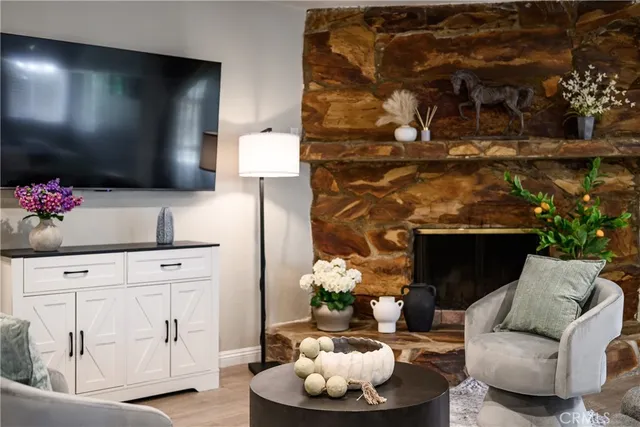 a living room with furniture and a fireplace