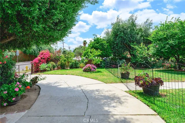 a childrens park with lots of green space and palm trees
