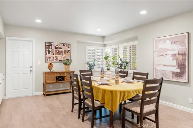 a view of a dining room with furniture and window