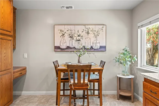 a dining room with furniture and window
