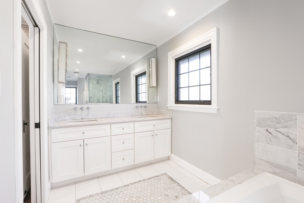 26 Greylock Road Newton, MA 02465 - Photo 17 of 28 a bathroom with a sink a vanity and a mirror