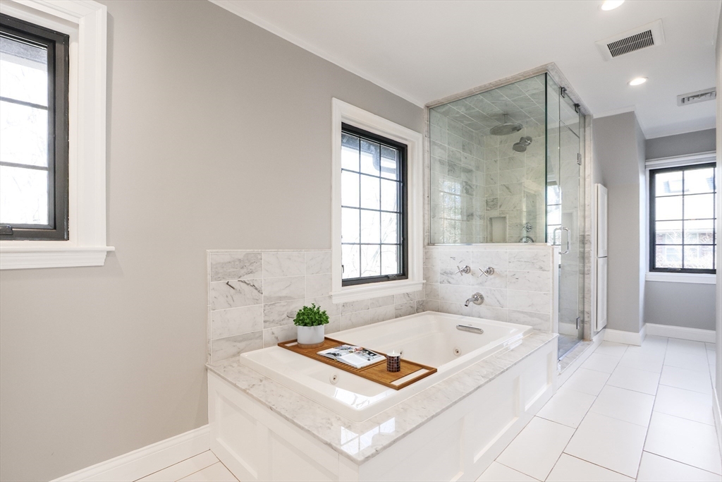 26 Greylock Road Newton, MA 02465 - Photo 18 of 28 a bath room with a bath tub and a window