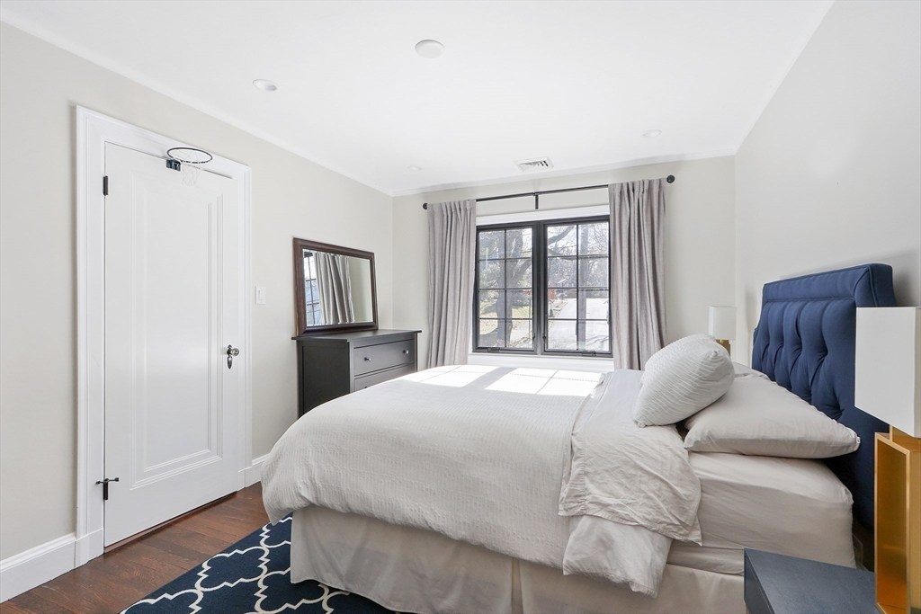26 Greylock Road Newton, MA 02465 - Photo 19 of 28 a bedroom with a large bed and a window