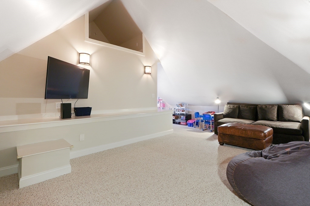26 Greylock Road Newton, MA 02465 - Photo 23 of 28 a living room with furniture and a flat screen tv