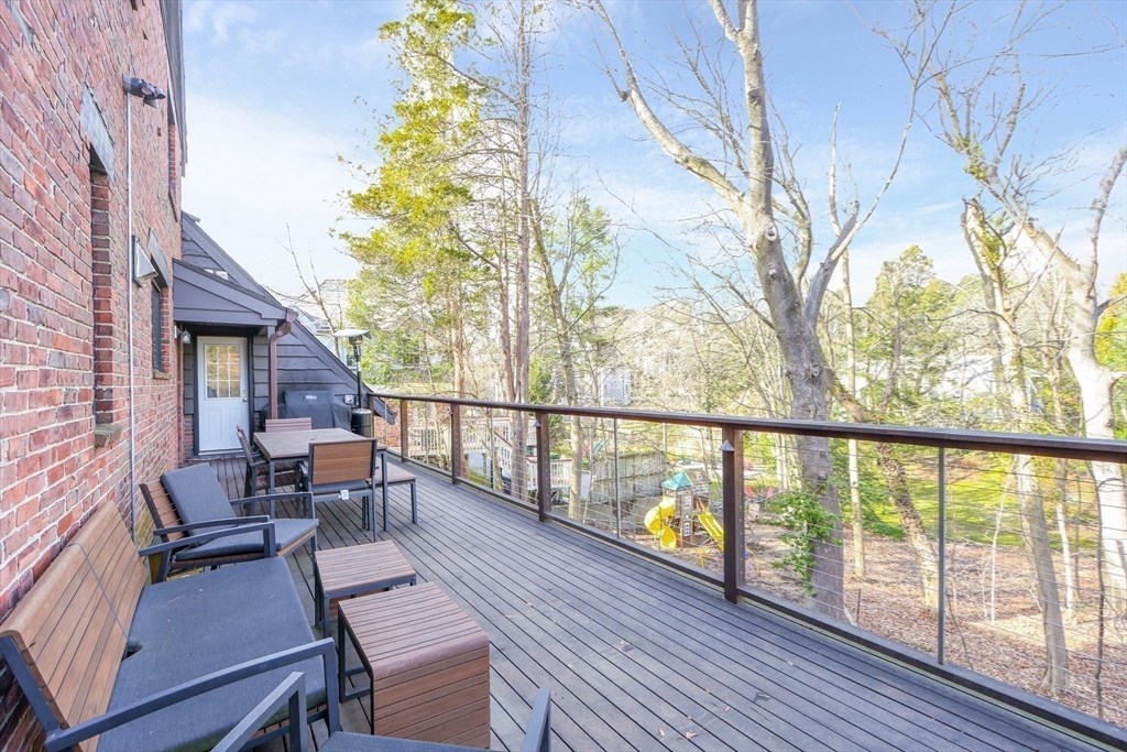 26 Greylock Road Newton, MA 02465 - Photo 24 of 28 a balcony with wooden floor table and chairs