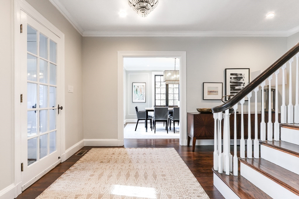 26 Greylock Road Newton, MA 02465 - Photo 3 of 28 a view of a hallway with wooden floor and windows