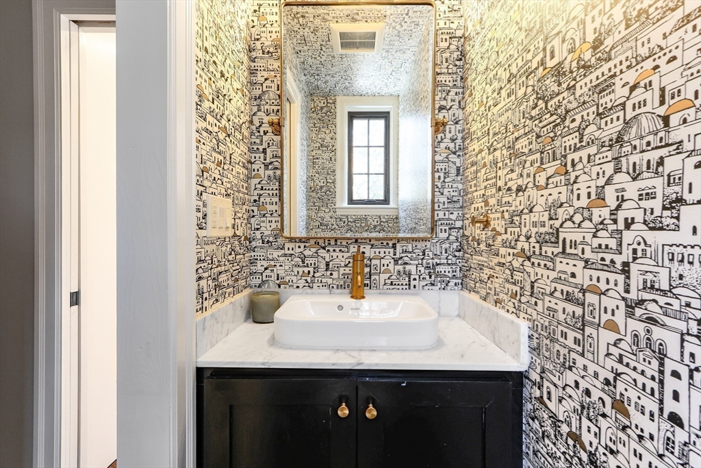 26 Greylock Road Newton, MA 02465 - Photo 5 of 28 a bathroom with a sink and a mirror