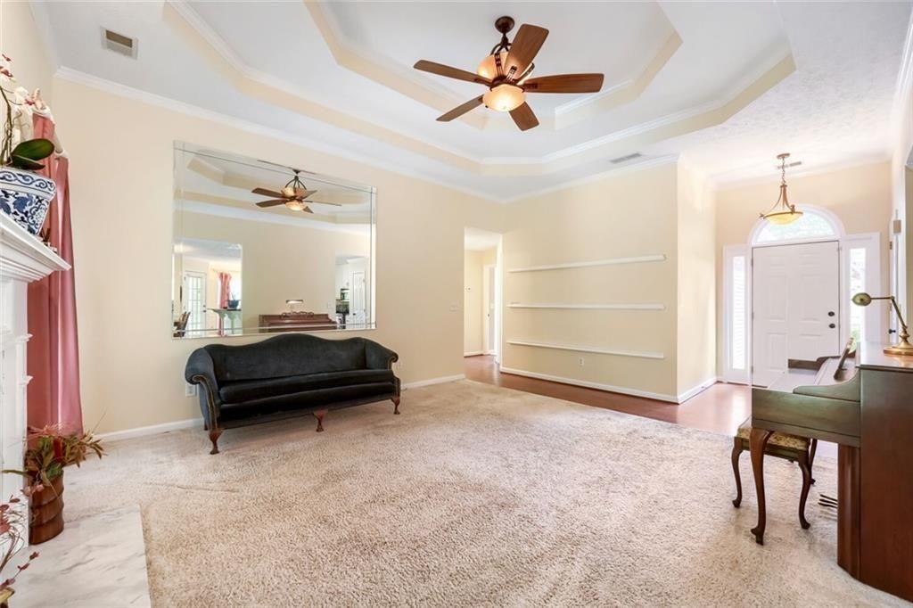 2128 Cluster Lane Grayson, GA 30017 - Photo 11 of 40 a bedroom with a bed a desk and chair