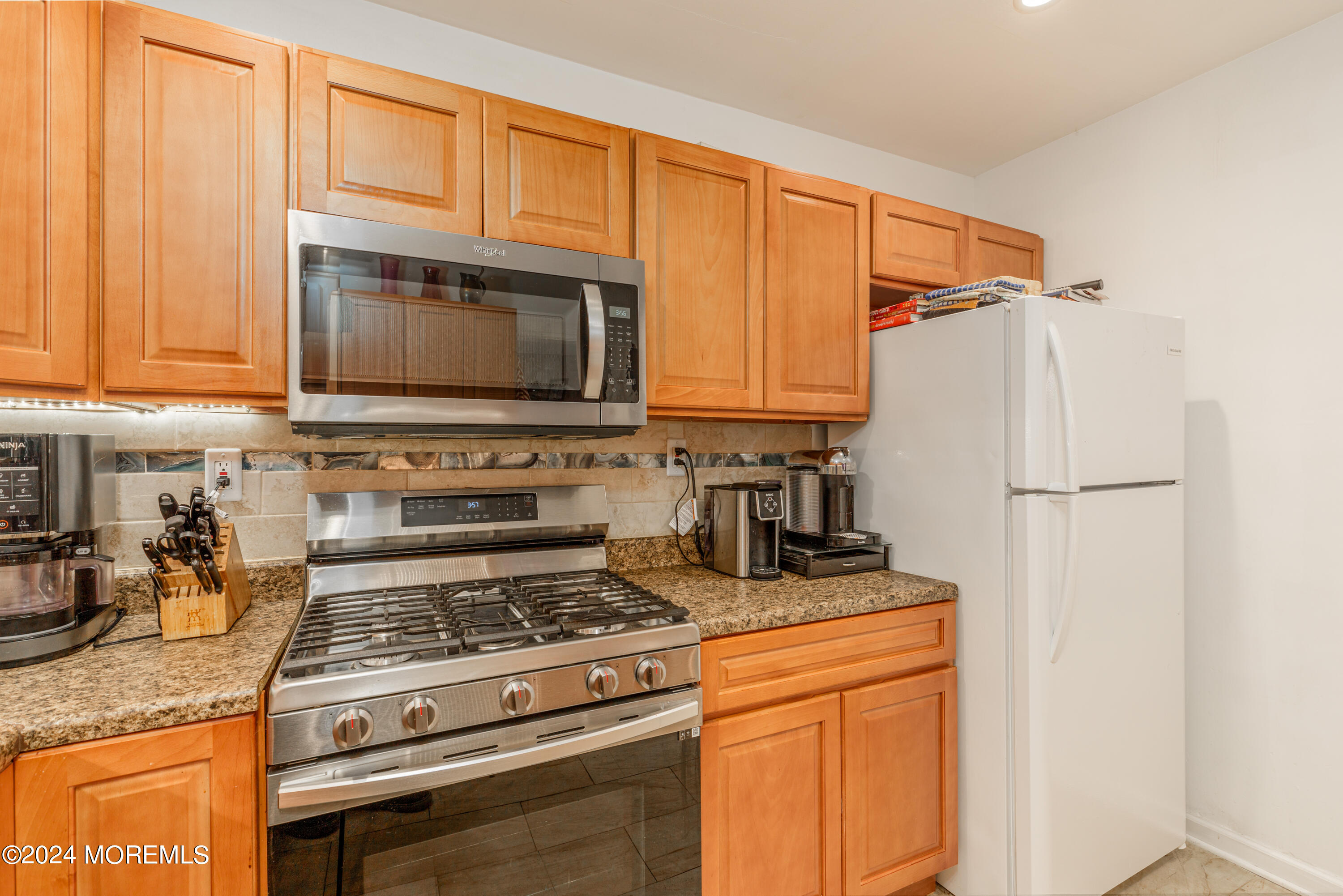16 Boundary Road Marlboro, NJ 07746 - Photo 16 of 28 a kitchen with granite countertop cabinets stainless steel appliances and a sink