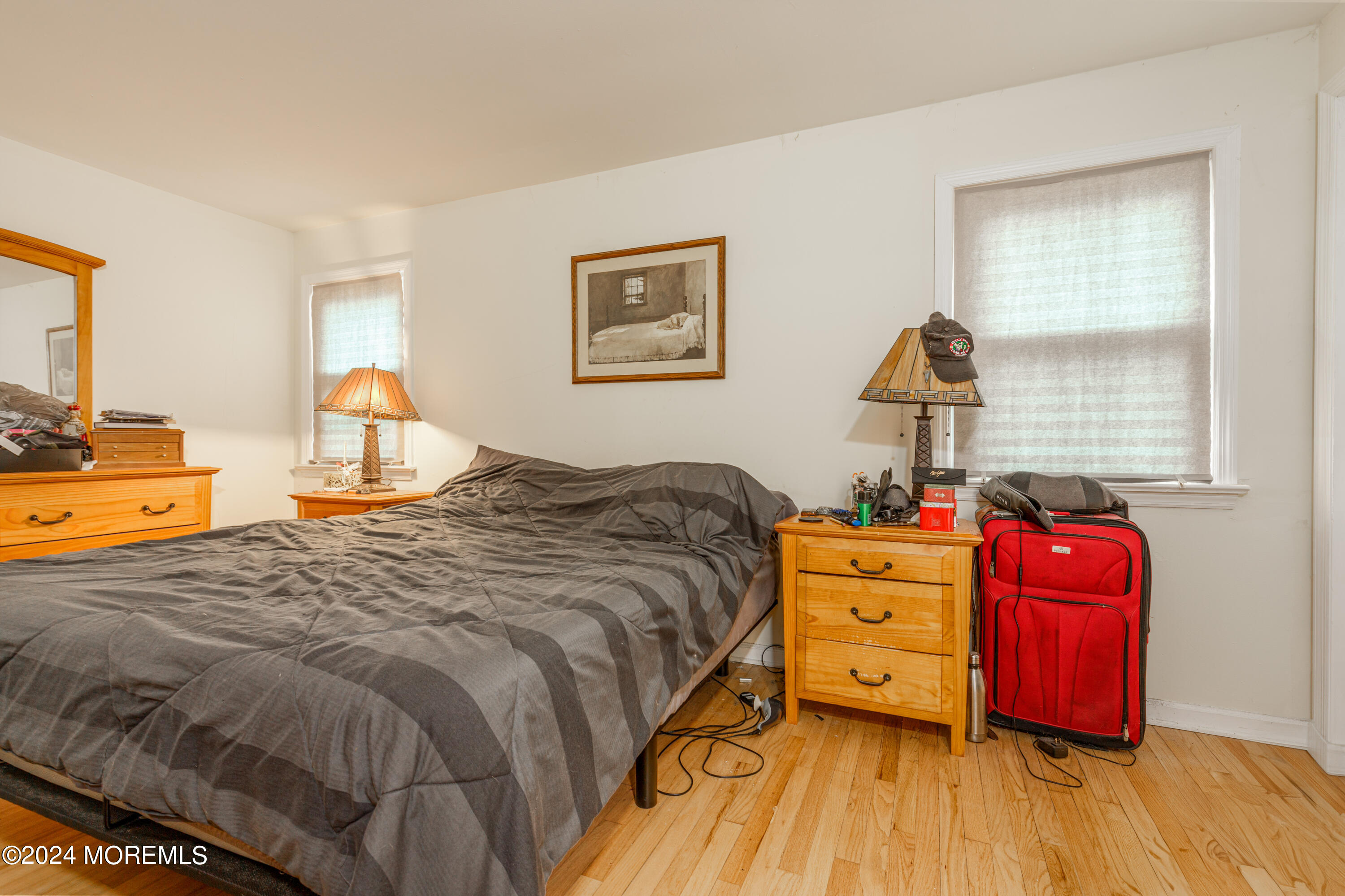 16 Boundary Road Marlboro, NJ 07746 - Photo 17 of 28 a bedroom with a bed and wooden floor