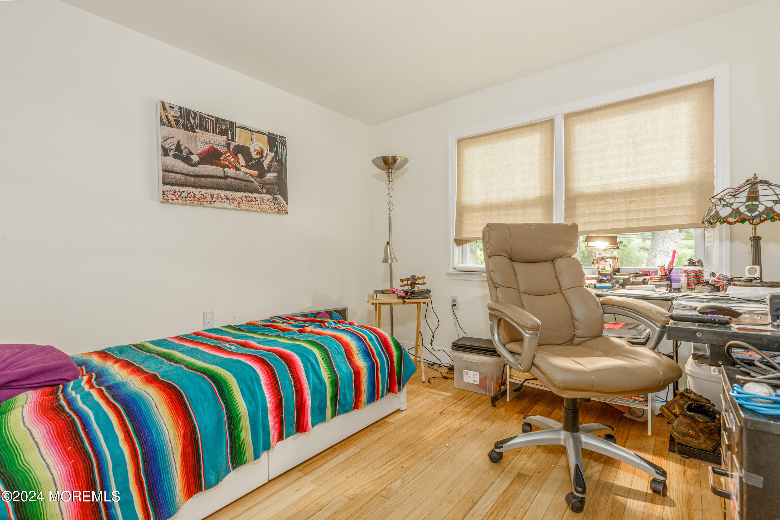 16 Boundary Road Marlboro, NJ 07746 - Photo 18 of 28 a bedroom with a bed and wooden floor