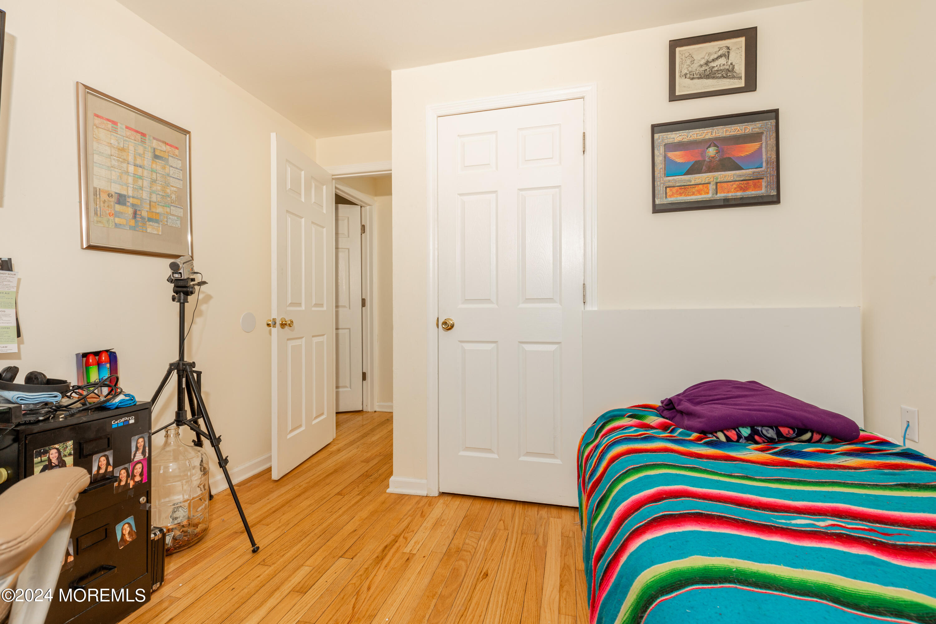 16 Boundary Road Marlboro, NJ 07746 - Photo 19 of 28 a bedroom with a bed and a wooden floor