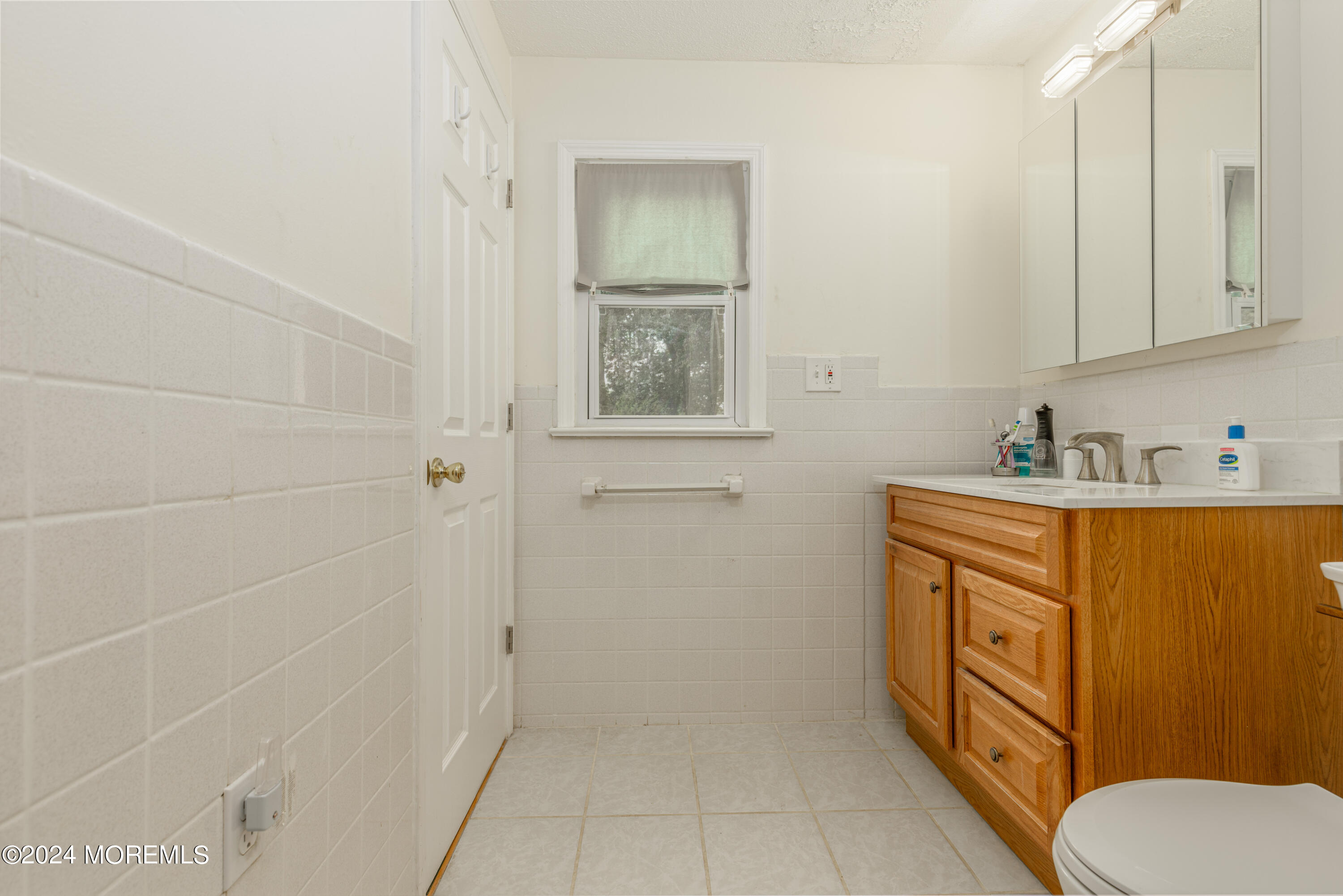 16 Boundary Road Marlboro, NJ 07746 - Photo 22 of 28 a bathroom with a granite countertop sink toilet and vanity