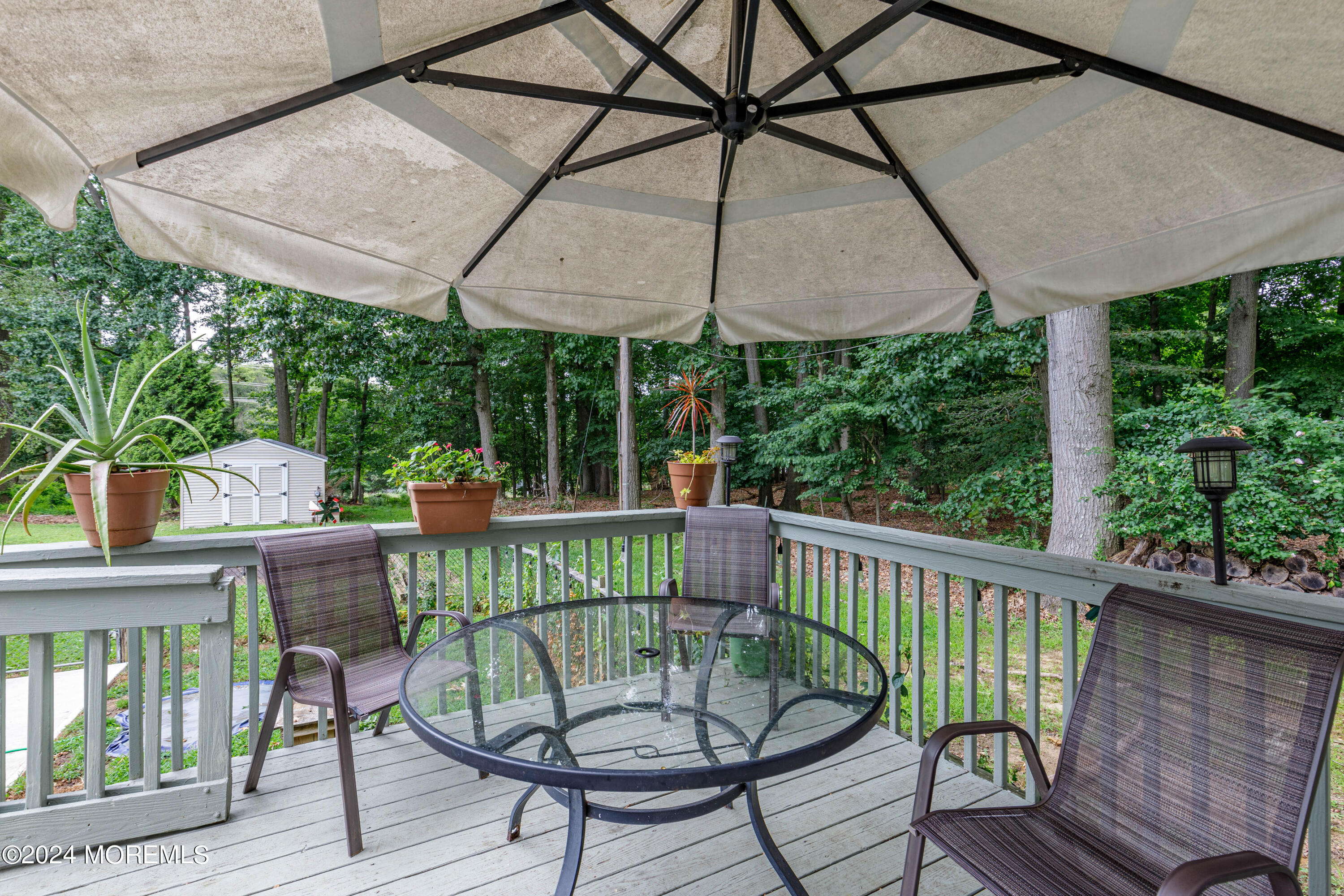 16 Boundary Road Marlboro, NJ 07746 - Photo 24 of 28 a view of a chair in wooden deck