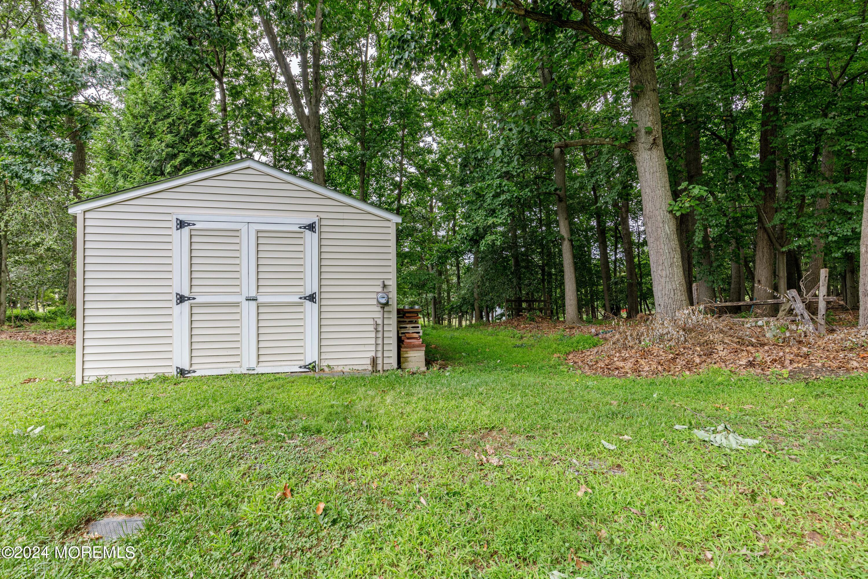 16 Boundary Road Marlboro, NJ 07746 - Photo 26 of 28 a view of a house with a yard
