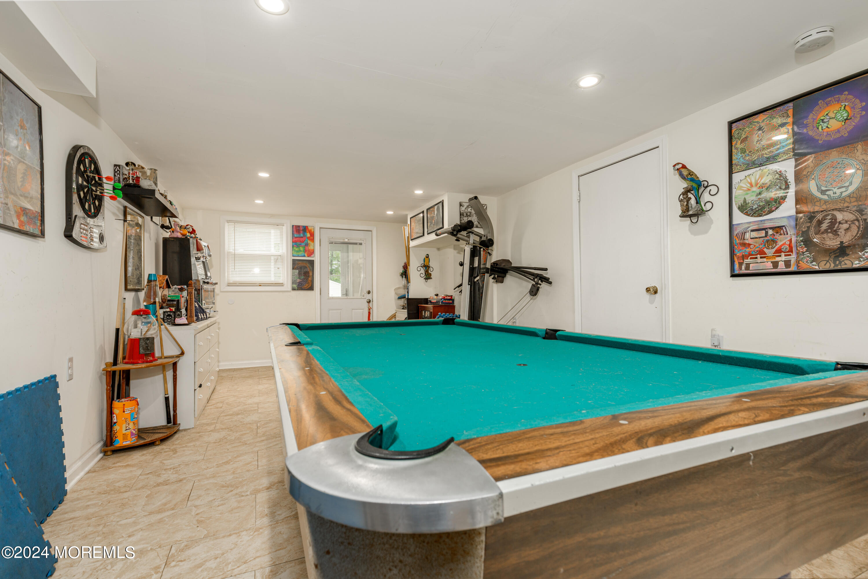 16 Boundary Road Marlboro, NJ 07746 - Photo 5 of 28 a room with gym equipment and large window