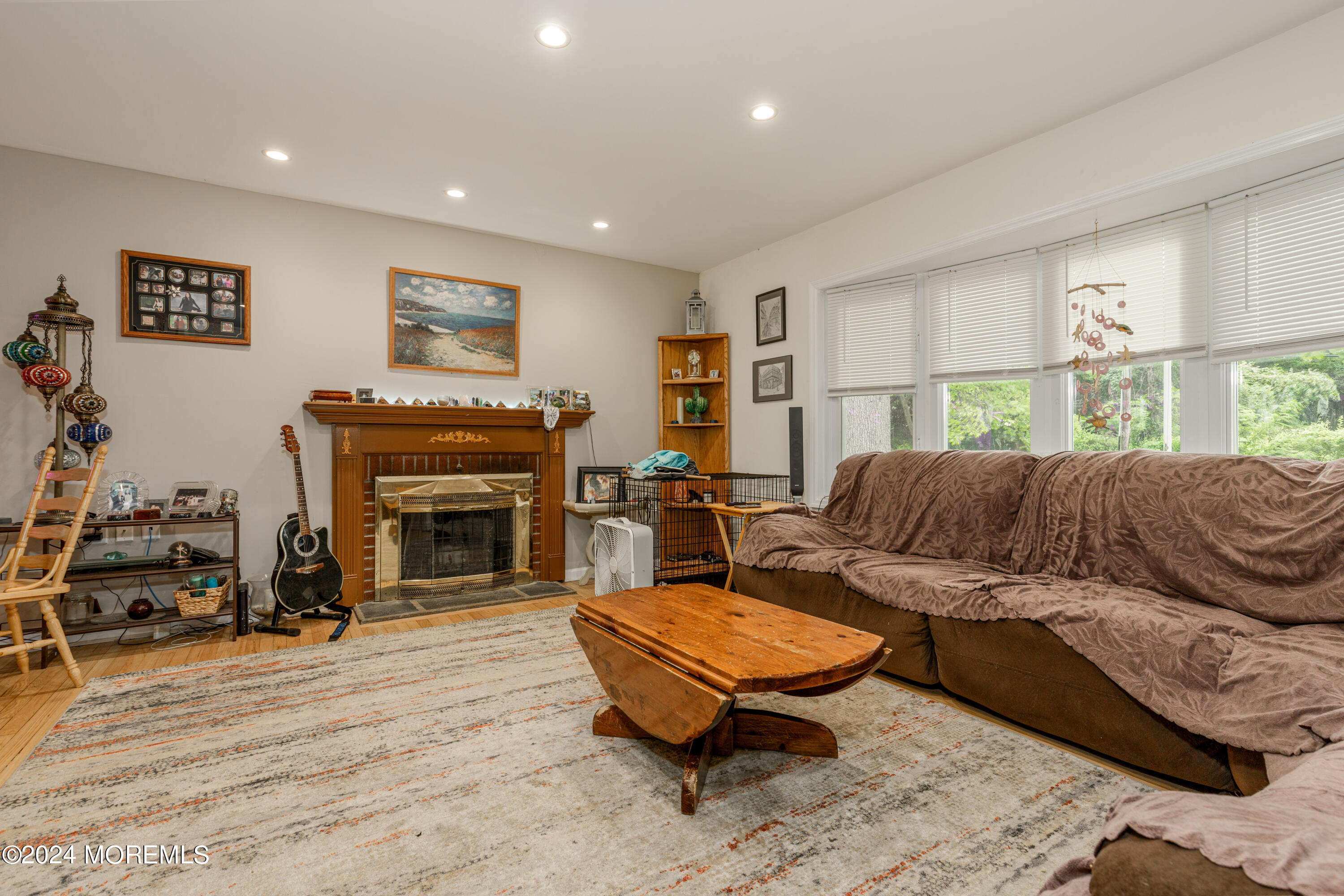 16 Boundary Road Marlboro, NJ 07746 - Photo 8 of 28 a living room with furniture a fireplace and a table