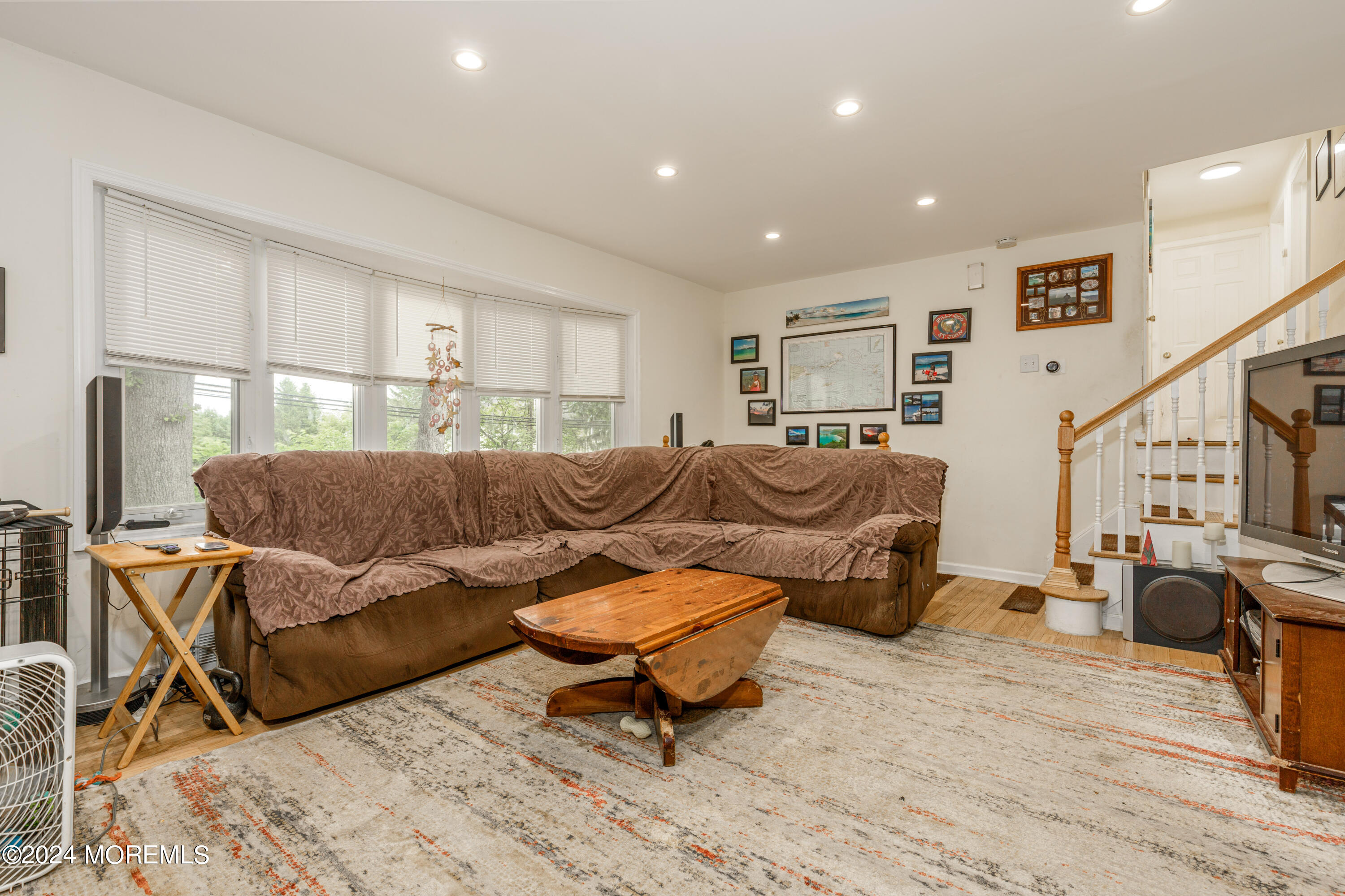 16 Boundary Road Marlboro, NJ 07746 - Photo 9 of 28 a living room with furniture and a fireplace