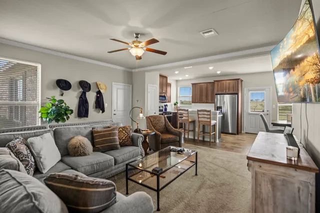 a living room with furniture and a large window