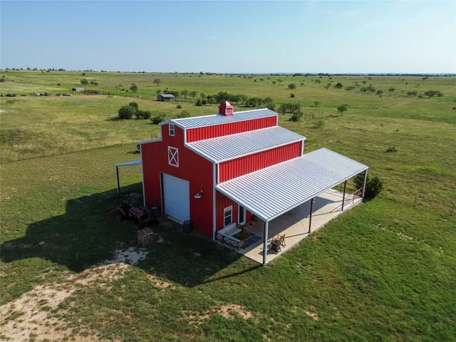 a aerial view of a house with a ocean view