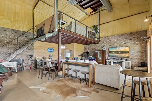 a view of a dinning tables and chairs in a patio
