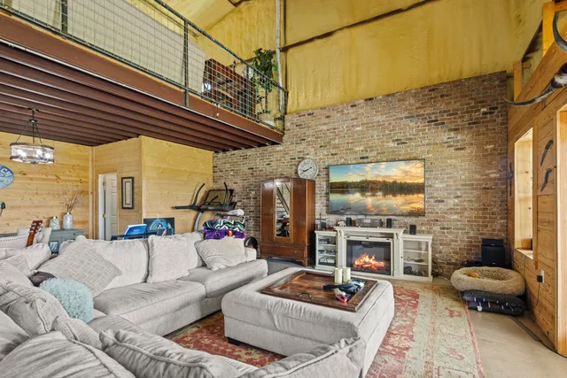 a living room with furniture and a window