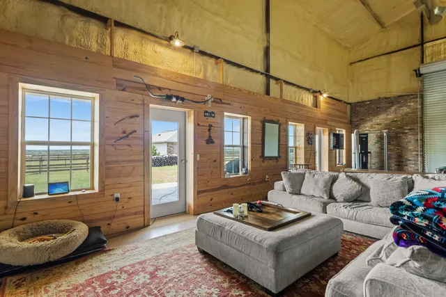 a view of a patio with table and chairs