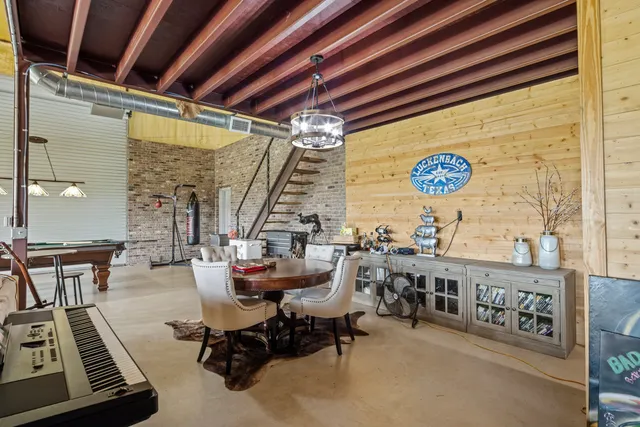 an aerial view of a residential houses with outdoor space