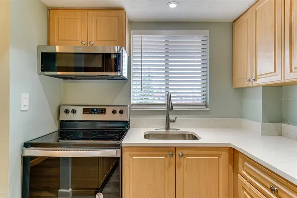 a kitchen with a stove and a microwave