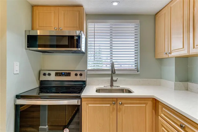 a kitchen with a stove and a microwave