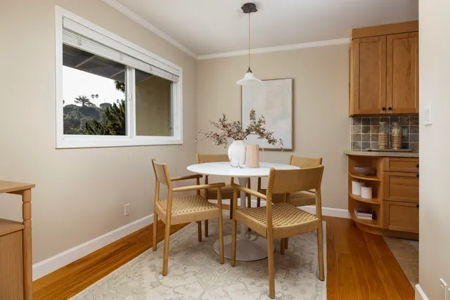 a dining room with furniture and window