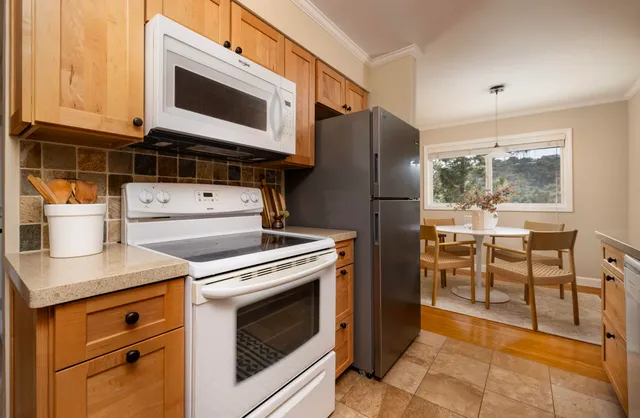 a kitchen with a stove and a microwave
