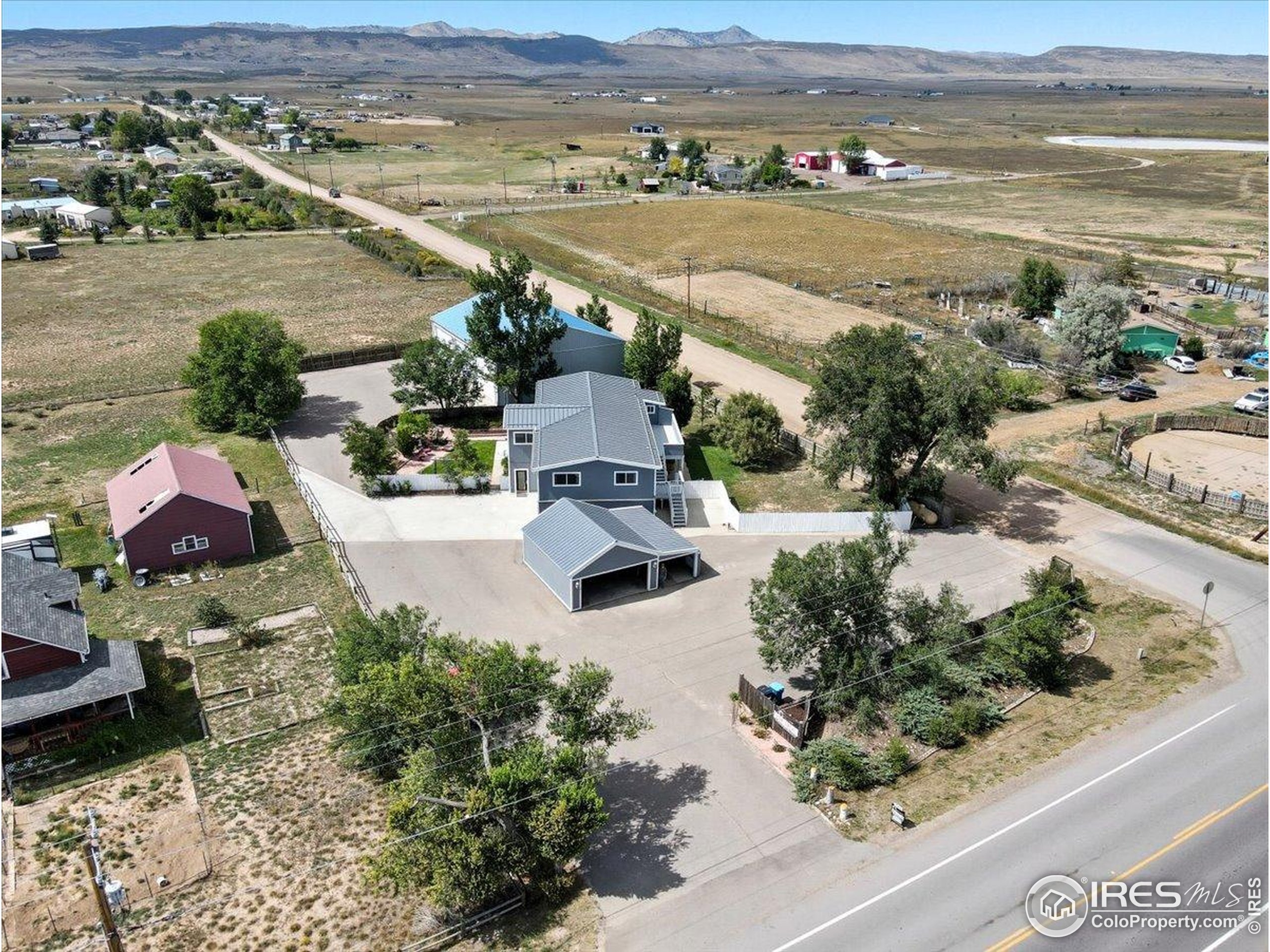 an aerial view of residential houses with outdoor space
