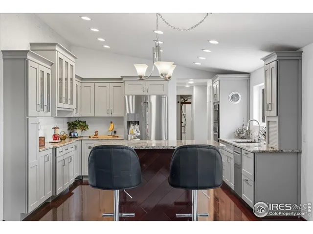 a bathroom with a sink a mirror and glass door