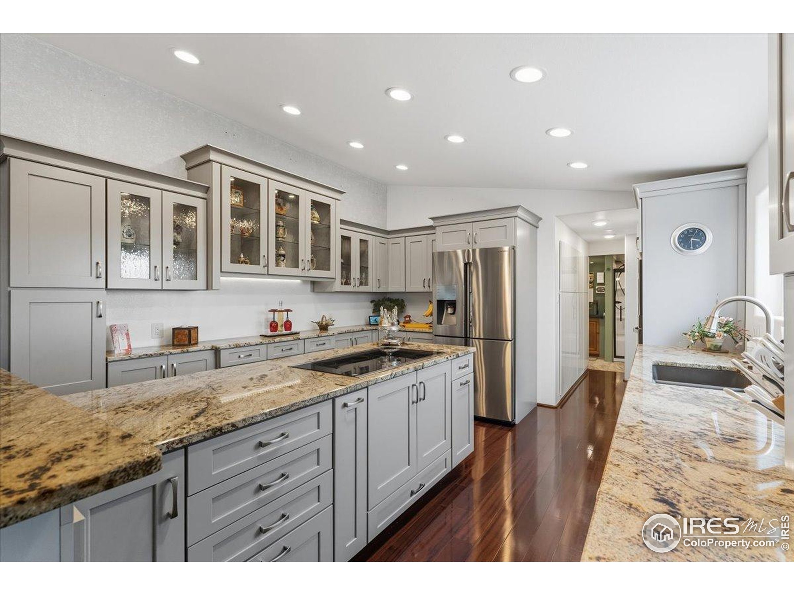 7133 North Co Road 19 Fort Collins, CO 80524 - Photo 13 of 50 a kitchen with granite countertop a sink stainless steel appliances and cabinets