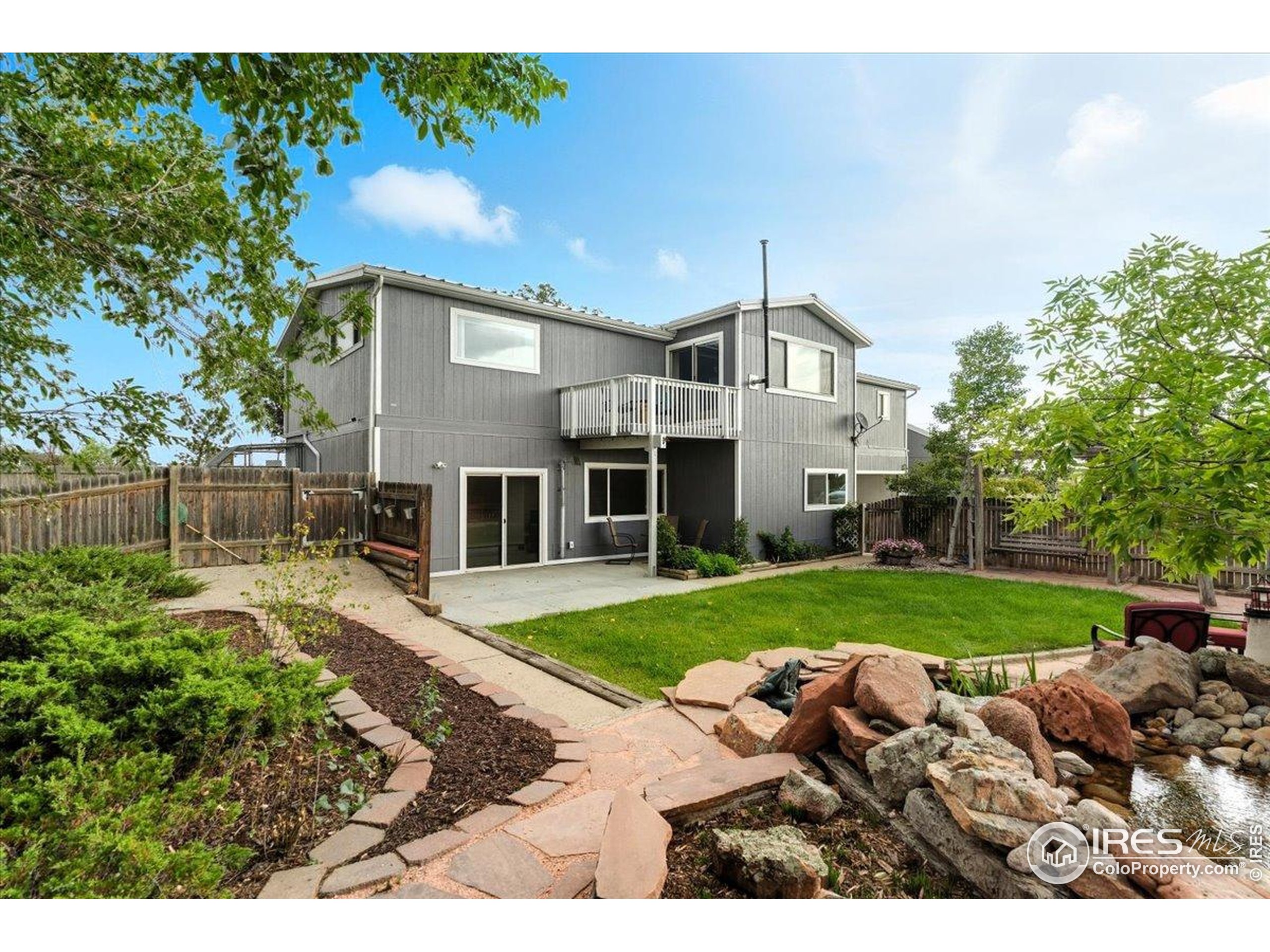 7133 North Co Road 19 Fort Collins, CO 80524 - Photo 43 of 50 a front view of a house with a yard