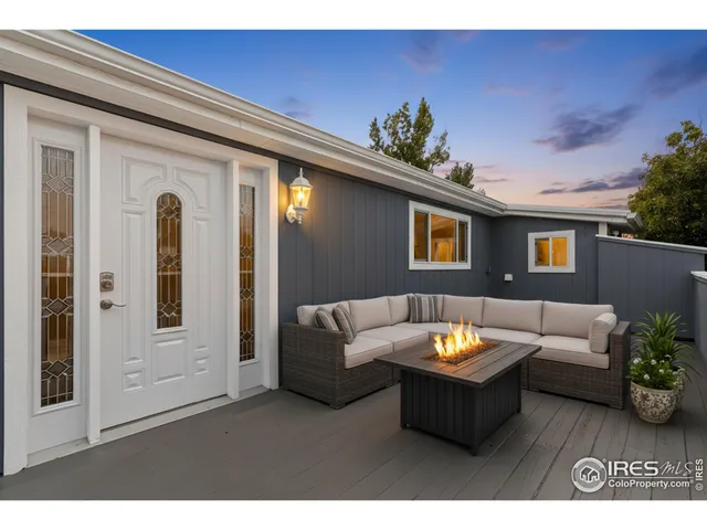 a kitchen with stainless steel appliances granite countertop a stove top oven a sink dishwasher and cabinets with wooden floor