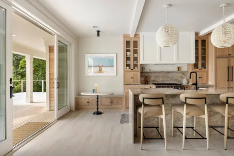 a kitchen with a sink cabinets and window