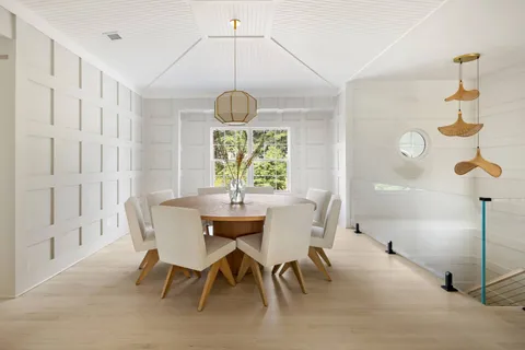 a view of a dining room with furniture window and chandelier