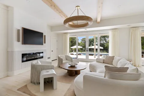 a living room with fireplace furniture and a flat screen tv