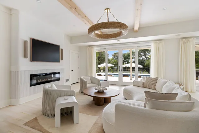 a living room with fireplace furniture and a flat screen tv