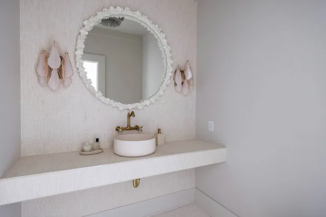 a bathroom with a sink and a mirror